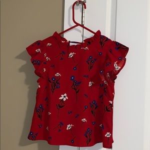 Red crop top w/ floral pattern.